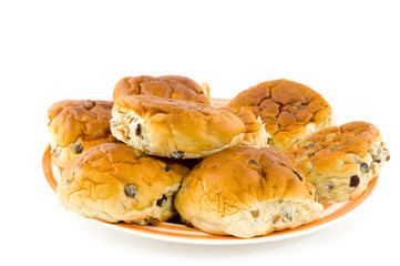 currant bread rolls on a plate isolated
