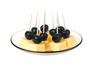 Black olive with cheese on plate over white