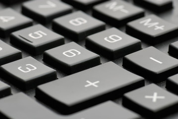 Closeup of a black calculator keyboard - Shallow DOF