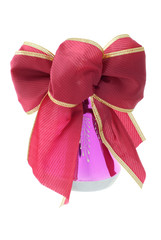 Red and gold gift bow with bell isolated on a white background
