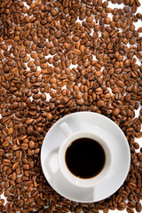 Cup with coffee, costing on coffee grain