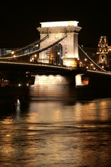 Budapest's famous landmark, chain bridge, illuminated at night.