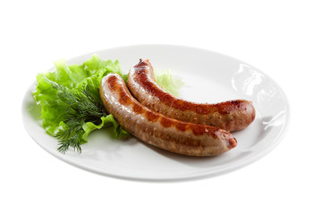 grilled sausage with lettuce isolated on white