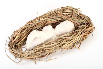 Christmas scene: baby Jesus figurine lying on hay