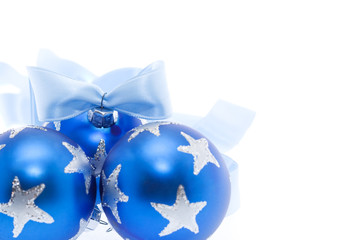 Blue christmas baubles and ribbon - isolated