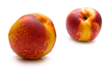 Red peach covered by drops of water. Isolated on the white
