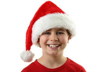 Christmas time - boy with Santa's hat isolated on white
