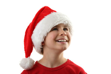 Christmas time - boy with Santa's hat isolated on white