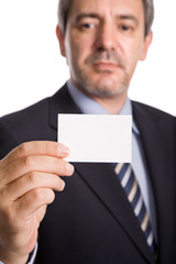 businessman offering business card, focus on the hand