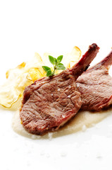 Grilled lamb cutlet on white plate