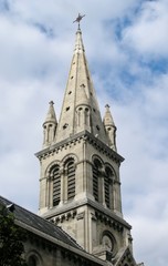 Fototapeta na wymiar High bell tower of catholic church