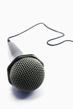 View of an usual microphone isolated over a white background.