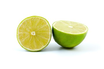 Two halves of lime isolated on the white background