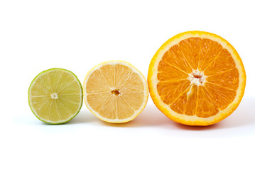 Halves of orange, lemon and lime isolated on the white