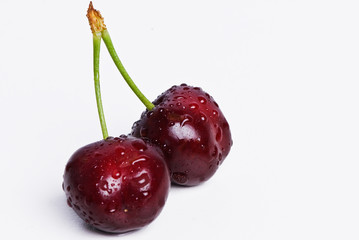 Two cherries joined by the stem.