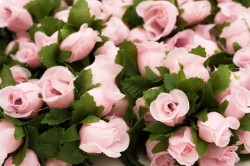 Large bouquet of pink roses with green leaves