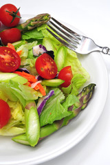 Dinner salad with assorted vegetable on a light background