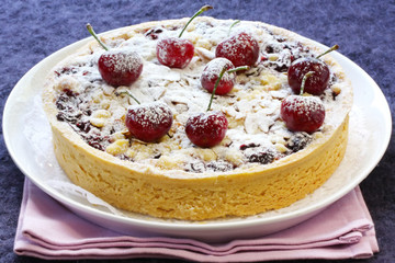 Cherry and almond tart or pie, ready for serving.