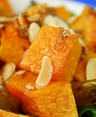 Roasted pumpkin and onion salad and toasted almonds.