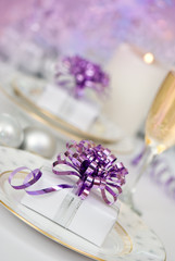 Obraz na płótnie Canvas Purple Christmas table setting at angle