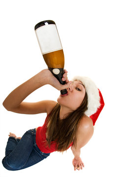 A Woman Wearing A Santa Cap Drinking Champagne. Fish Eye Lens.