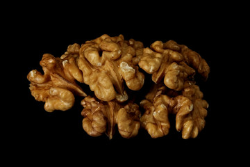 Walnuts. Nuts on a black background.