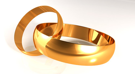 Wedding gold rings on the light background, being nearby
