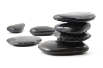 black stones in balance isolated on white background