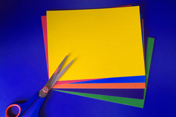 craft materials.scissors  on some coloured paper