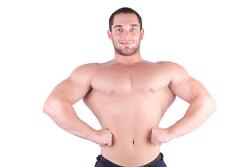 Fototapeta premium young bodybulider posing in front of white background