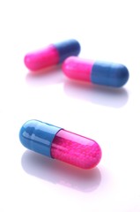 Pink and blue capsules