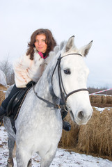 Fototapeta premium Girl on a horse.winter landscape