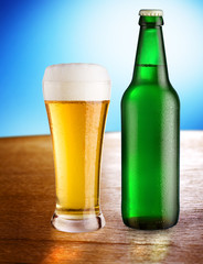 Glass with beer and bottle