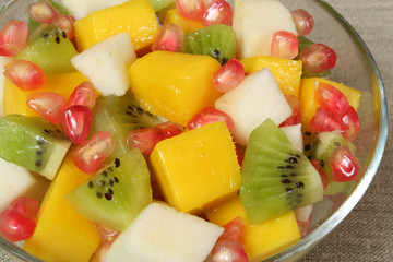Fruit salad with kiwi, mango, pear and pomegranate