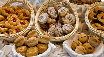 Baskets of fresh baked pastries at a buffet