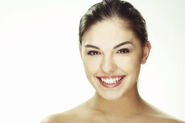 A happy young woman with facial expression on white background