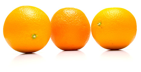 The ripe whole oranges with real reflexion on white. Isolation