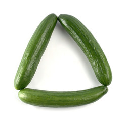 Triangle made of cucumbers, isolated over white