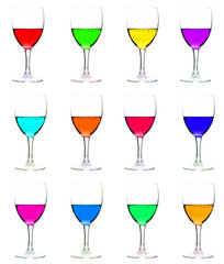 wine glasses with multicolor liquid, isolated on white