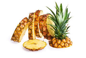 A pineapple sliced up, isolated on white.
