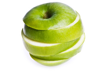 An apple sliced into peices, isolated on white.