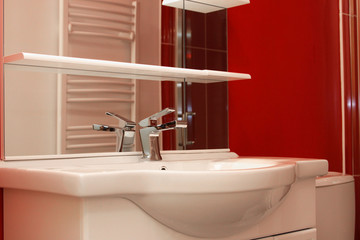 tap of bathroom with a red design