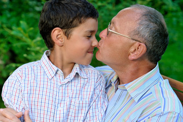 Fototapeta premium Grandfather and grandson outdoors
