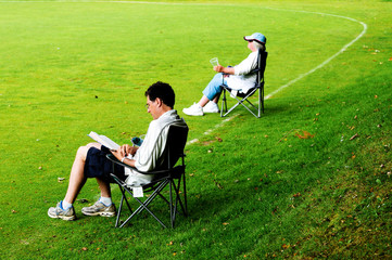 outdoor portrait of spectators in deckchairs