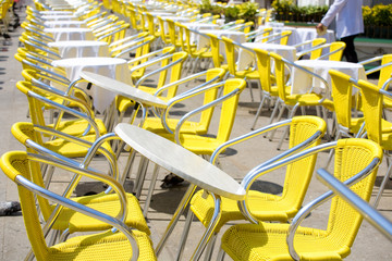Restaurant tables outdoors. Lots of tables.