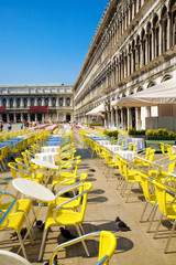 Restaurant tables on Venice San Marco square.