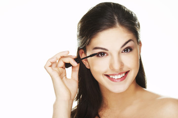 Fototapeta premium Pretty woman applying make up