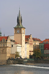 Fototapeta na wymiar Clock tower on the Moldau in Prague