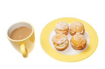 Coffee and butterfly buns isolated on white