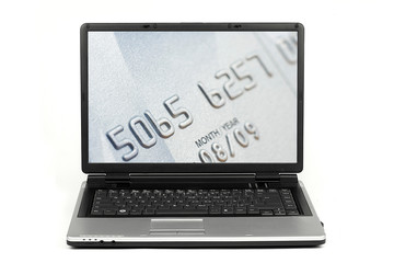 Close-up on credit card on laptop screen isolated